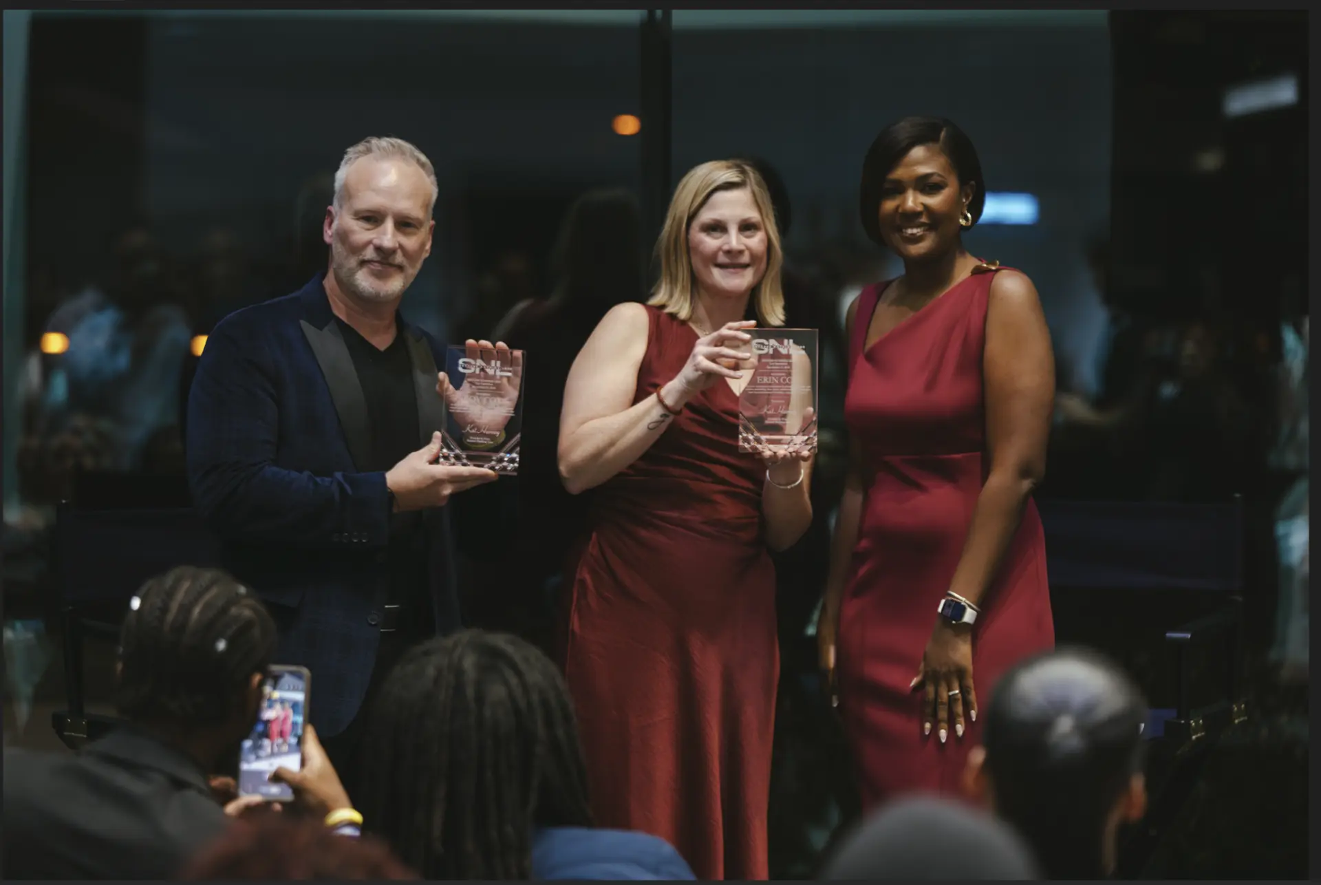 Roy Cox, Erin Cox and Kat Harvey holding their Success Nothing Less awards