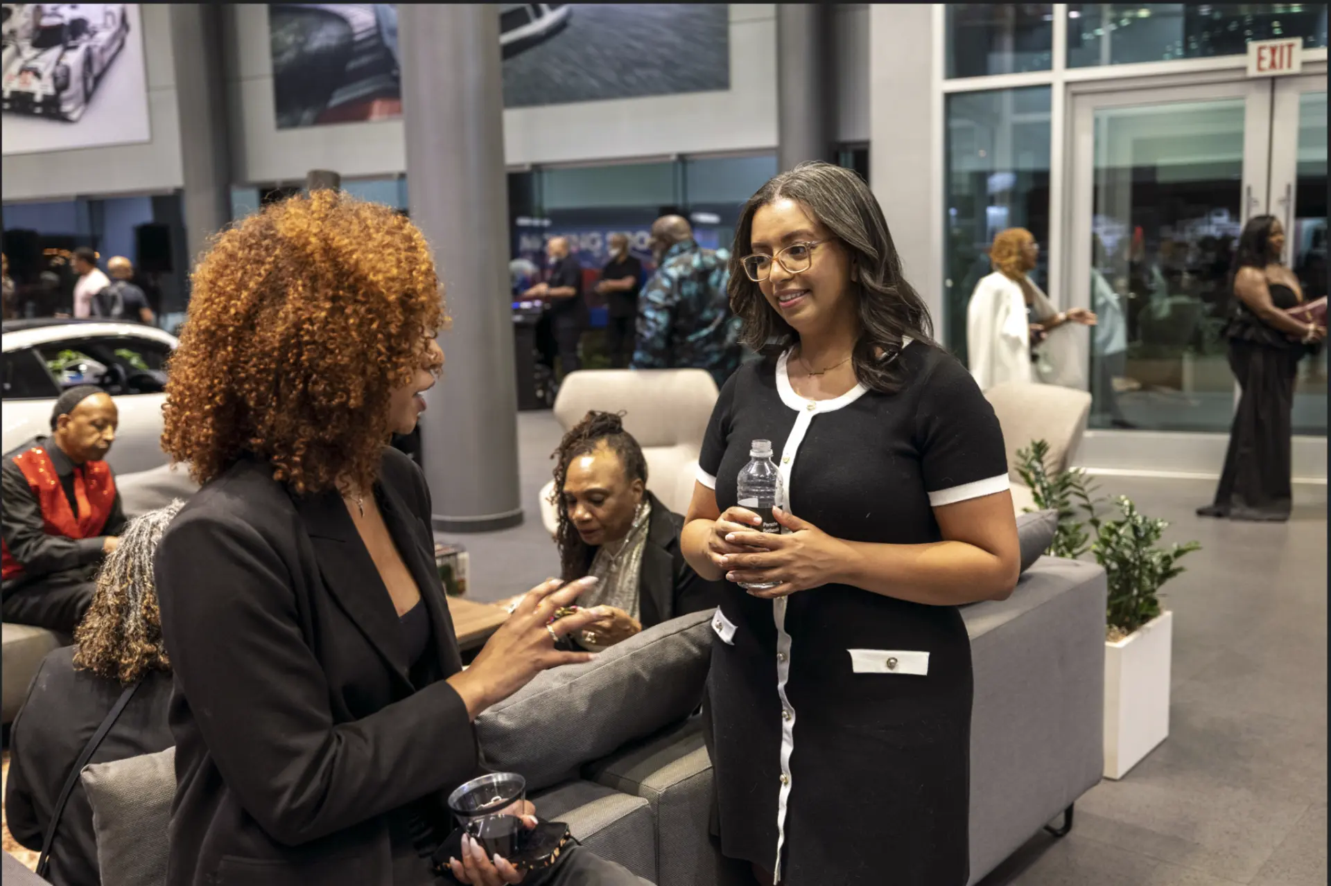 Two guests connecting at Success Nothing Less, Porsche Bethesda