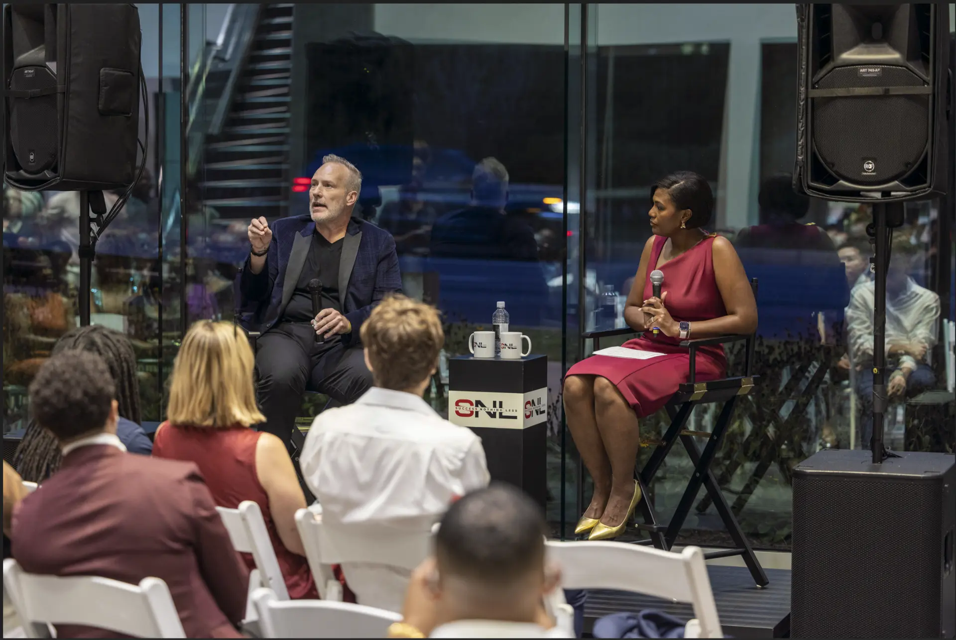 Kat Harvey and Roy Cox in live conversation before a Success Nothing Less audience